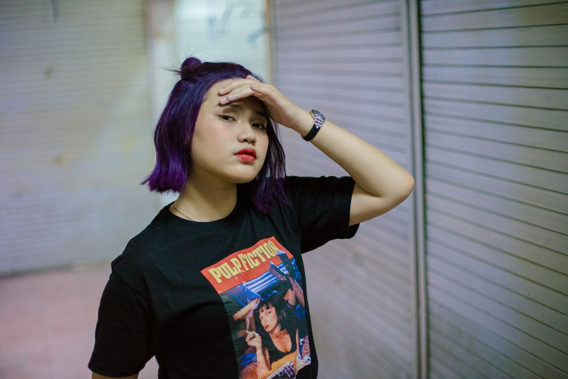 Person wearing a bold graphic tee — street editorial style